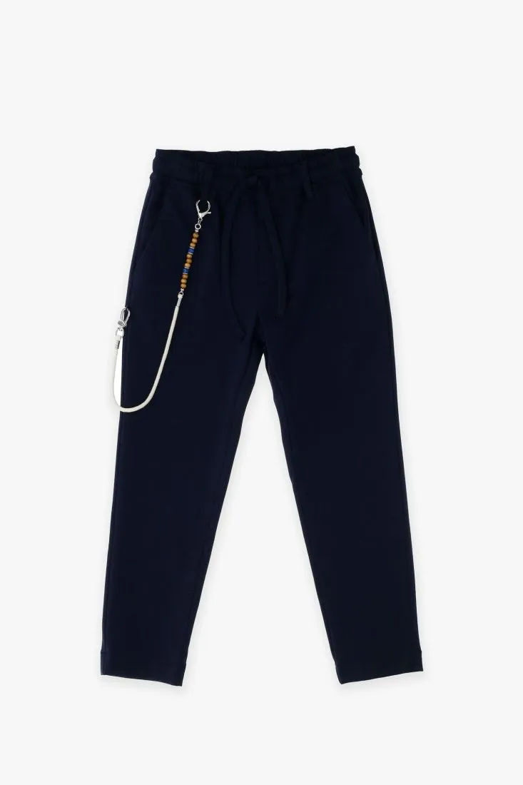 Pantaloni slim-fit bambino monocolour con coulisse e catena